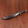 Curved souvenir knife, 26.5 cm, a long curl on the scabbard, black