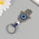 Keychain from the evil eye metal "Fatima hand" 4x8.2 cm