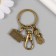 Browler Metal with carbine "camera and girl" bronze 6.2 cm