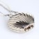 Female bag on a magnet, silver color
