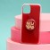 New Year's gift set, a case for a phone with a Happy New Year holder, on the iPhone 11 Pro