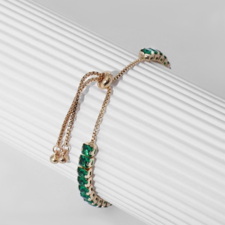 Bracelet with rhinestones "shine" on a puff, emerald color in gold-5