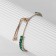 Bracelet with rhinestones "shine" on a puff, emerald color in gold