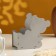 Gift packaging "Bear with a gift" 17x8x16 cm gray pastel-tyffany