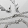 Set 4 objects: earrings, necklaces, bracelet, ring "pattern" thin, white color in silver