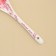 Spoon of souvenir “mothers like button”, ceramics, 2.5 x 12.5 cm.
