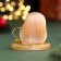 The souvenir "Stability is everywhere and in everything! 2025", with a bell, selenite, 6x6x4.5 cm