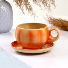 A cup with a saucer, orange, 0.2l