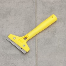 Scraper for windows, walls and floor with a blade