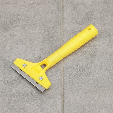 Scraper for windows, walls and floor with a blade