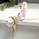 Souvenir Ceramics "Cat white-golden with a chain of rhinestones" 17 cm