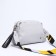 Richet Cross-Body bag, external pocket, 2 long belts, gray color.