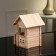 The designer is a wooden “House with a veranda”, 102 details, an array of beech