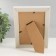 Photo frame plastic 10x15 cm "Golden waves and points" white 13.5x18.5 cm