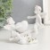 Polystone souvenir "Angels in pink wreaths swing on a rocking chair" 10x11x4.5 cm