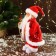 Santa Claus "in a patterned vest, with gifts" moves, with backlight, 28 cm, red