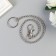 Chain d/keys with a carbine 3.5x1.3 cm on a ring d = 3 cm twisted silver 30 cm
