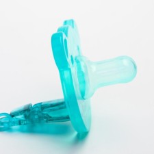 The dummy is whole -diligent, with the holder, in the container, from 0 months, the color is green