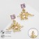 Earrings with rhinestones "dinosaurs", purple color in gold