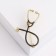 Brooch "Stetoscope", black color in gold