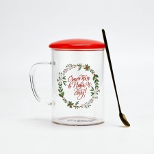 A mug with a spoon and a lid 