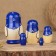 Matryoshka "God's cow", blue dress, 5 puppet, 9-10 cm