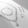 Set 4 objects: earrings, necklaces, bracelet, ring "pattern" thin, white color in silver