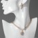Set 3 objects: earrings, necklaces, ring "Izd" flower in geometry, white color in gold
