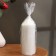Candle-cylinder with faces, 5x13 cm, white, 10 hours