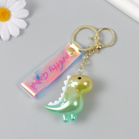A plastic keychain with a carbine, a dinosaurus strap is green 2.5x5x5x5 cm-2