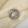 Clip for the scarf "pearl curl", the color is white in matte silver