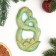 Panel with the suspension "Snake in the flower" Green with gilding, 12x7x1cm