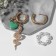 Earrings with the removable element of the "transformer" snake, the color is white-green in gold