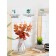 Flower composition "Eucalypt" in a bottle vase, orange / transparent color