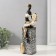 Polystone souvenir "African with a tambourine on a column with patterns" white-black, gold 10.5x9x32 cm 10325