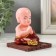Plastic pendulum from the solar battery "Little Buddha prays" 7.3x7.3x8.8 cm