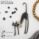 Brooch "Graceful cat with a bow", the color is black in gold