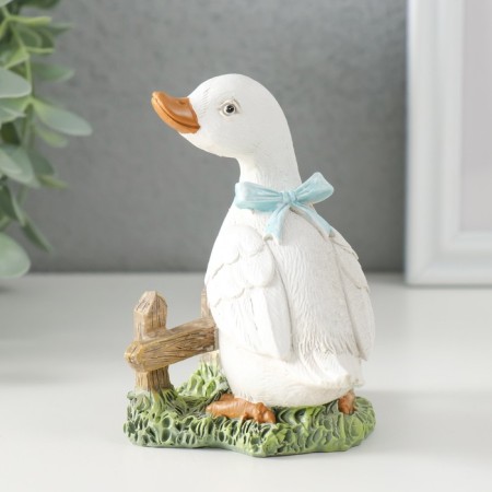 Polystone souvenir "Gusenok with a blue bow at the fence" 9x8x10 cm