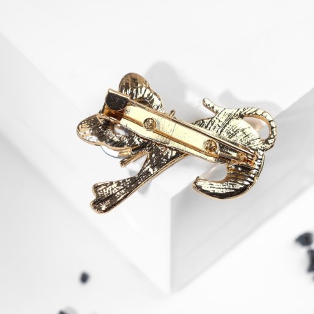 Brooch "Kit" with a bow, the color is emerald white in gold-2