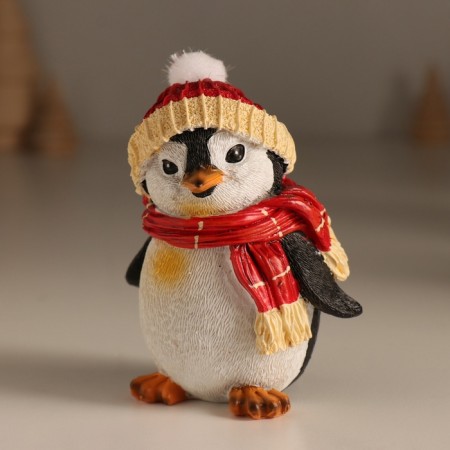 Polystone souvenir "Gloomy penguin in a hat with a bomb, in a red scarf" 7.5x6x9.5 cm