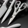 A set of BLADES kitchen supplies, 5 objects: 3 knives, vegetable vegetables, scissors in the kit, white color