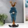 Polystone souvenir "Elk in a blue jacket and red butterfly" 30x12.5x11.5 cm