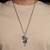 Pendant "Cross" with a snake, color black silver, l = 70 cm