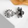 Cardigan clamp "Bee", sewing, black and white color in silver