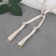 The straps of textile, cross -shaped, 1 cm, beige color