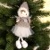 Doll "Mila in a hat", on a suspension, color mix