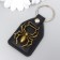 Keychain to the leatherette, metal "spider" 4x6 cm