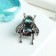 The Galiotis icon is a small fly, the color is green in black silver