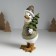 Polystone souvenir "Goose in a sweater in peas, carries the Christmas tree" Light green 9.5x12x22.5 cm