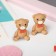 Clips children's “chosen” bears with a bow, brown color